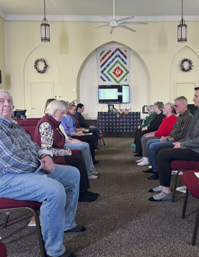 Group of adults in a mediation session.